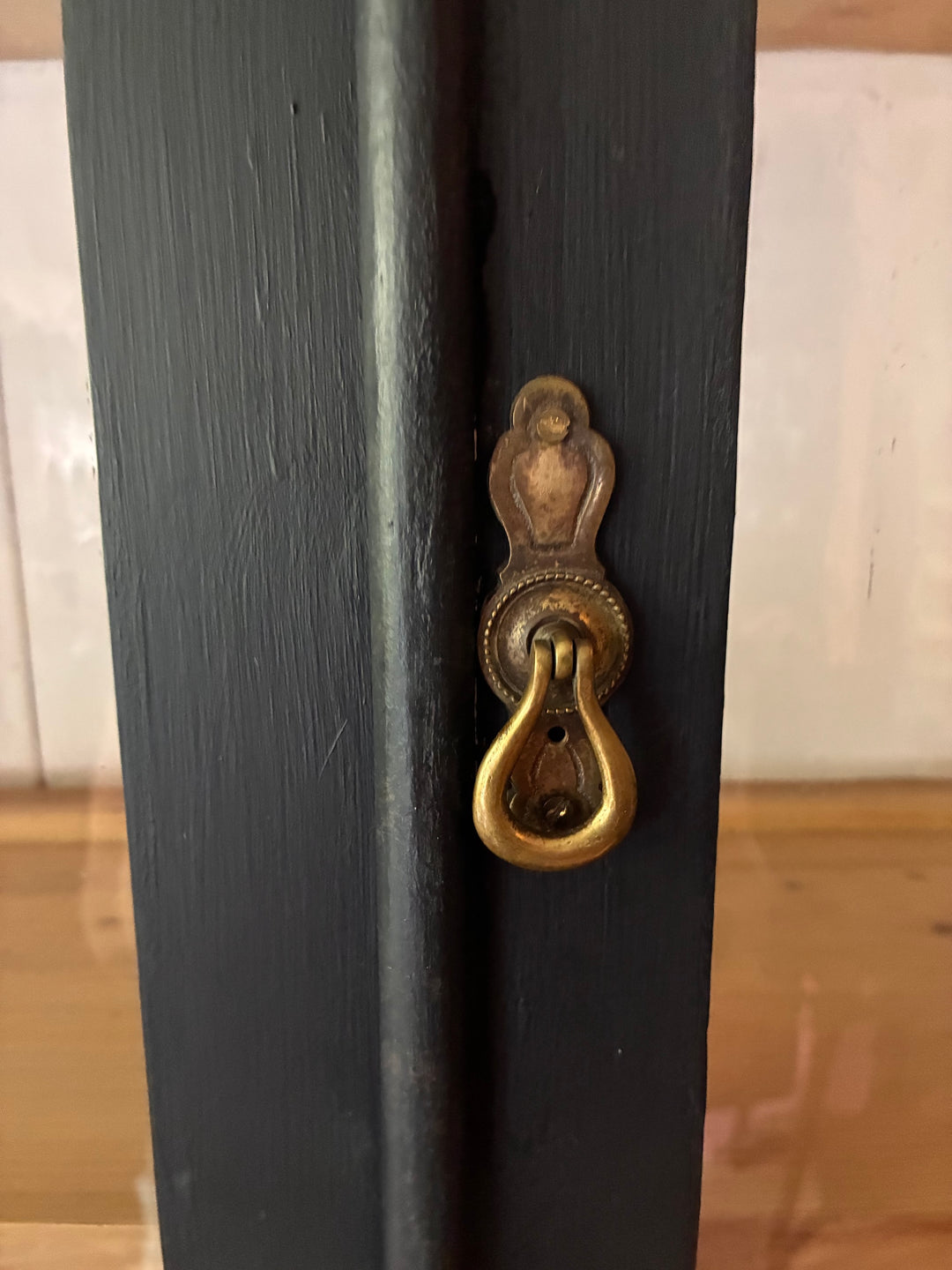 Close-up of the antique lock on the Ebonised Victorian Pine Dresser, showcasing its detailed brass hardware.