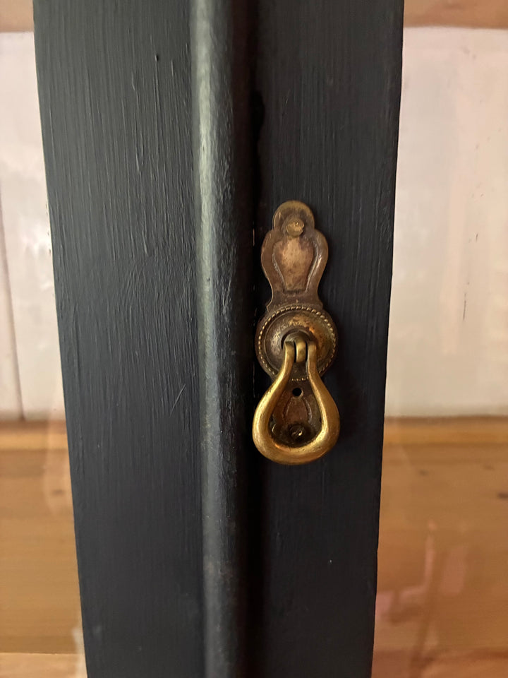 Close-up of the antique lock on the Ebonised Victorian Pine Dresser, showcasing its detailed brass hardware.