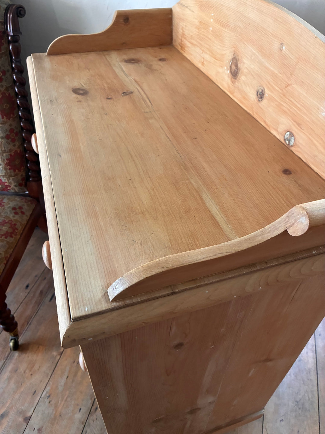 Small Antique Pine Chest of Drawers - Galleried Back with a rustic finish and elegant galleried back detail.