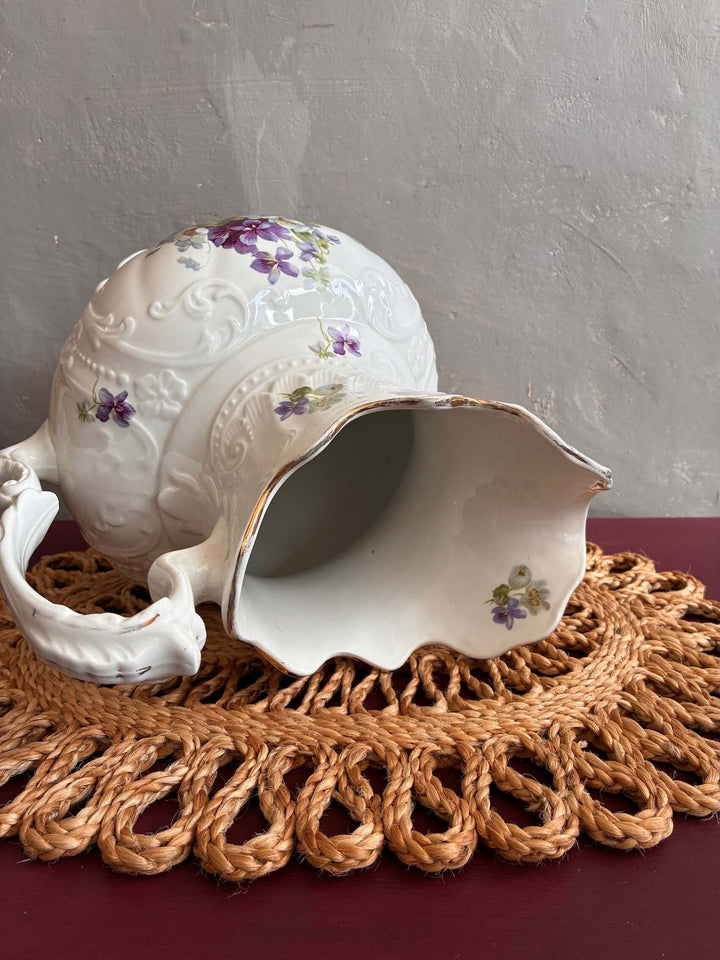 Pretty Floral Victorian Pitcher Jug on a woven placemat, showcasing elegant design ideal for floral displays - Source for the Goose, Devon.