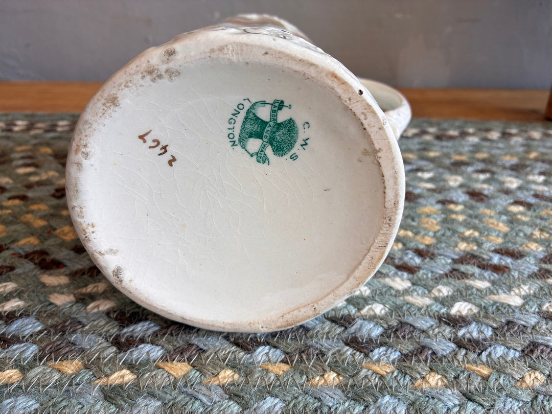 Bottom view of a Small Edwardian China Jug with Yellow Flowers, showcasing CWS mark and vintage charm.