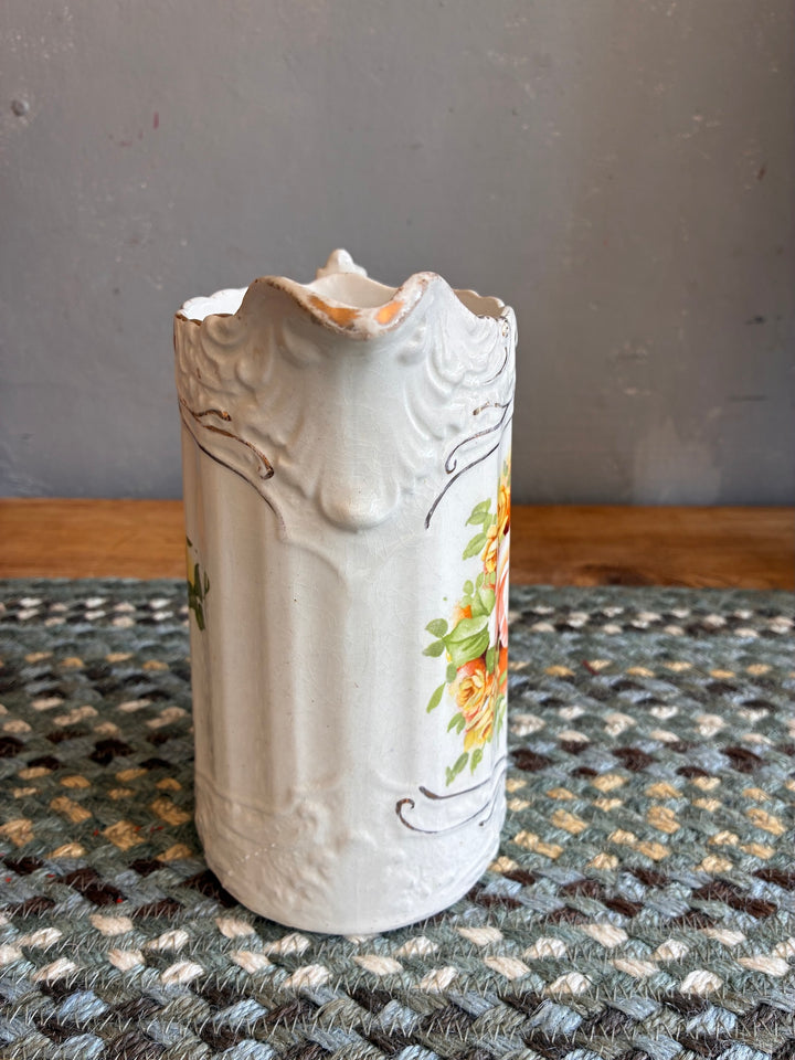 Small Edwardian China Jug with Yellow Flowers displayed on a woven mat, showcasing intricate floral design and vintage character.