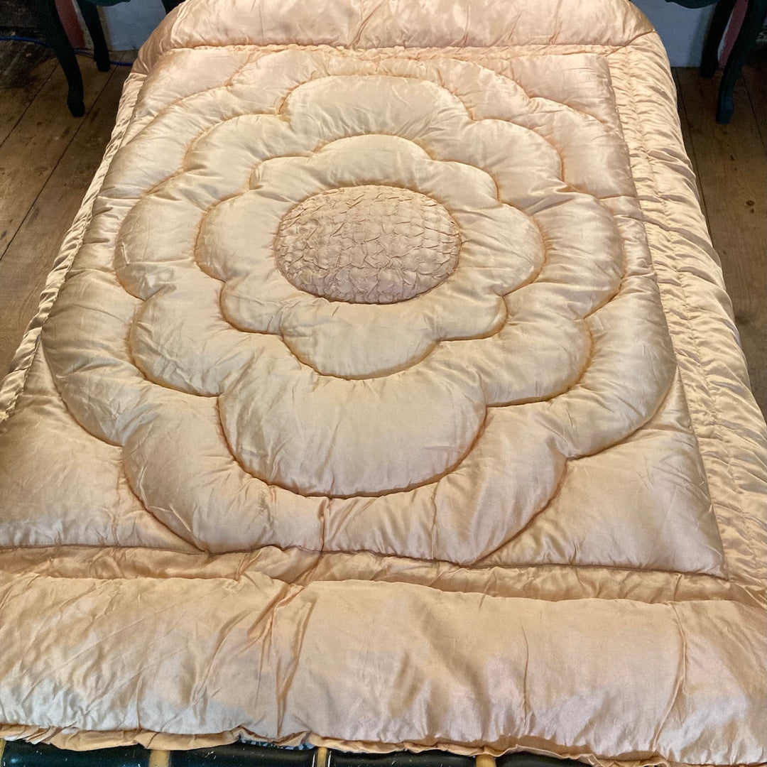 Vintage 1930s Single Eiderdown with creamy apricot gold satin and plump quilted floral design for retro charm.