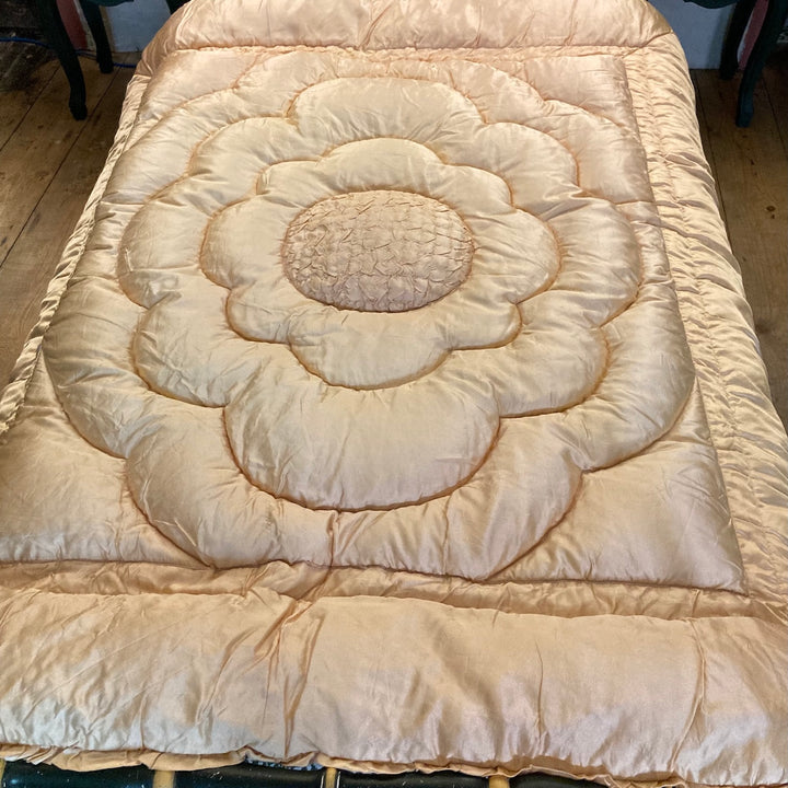 Vintage 1930s Single Eiderdown with creamy apricot gold satin and plump quilted floral design for retro charm.