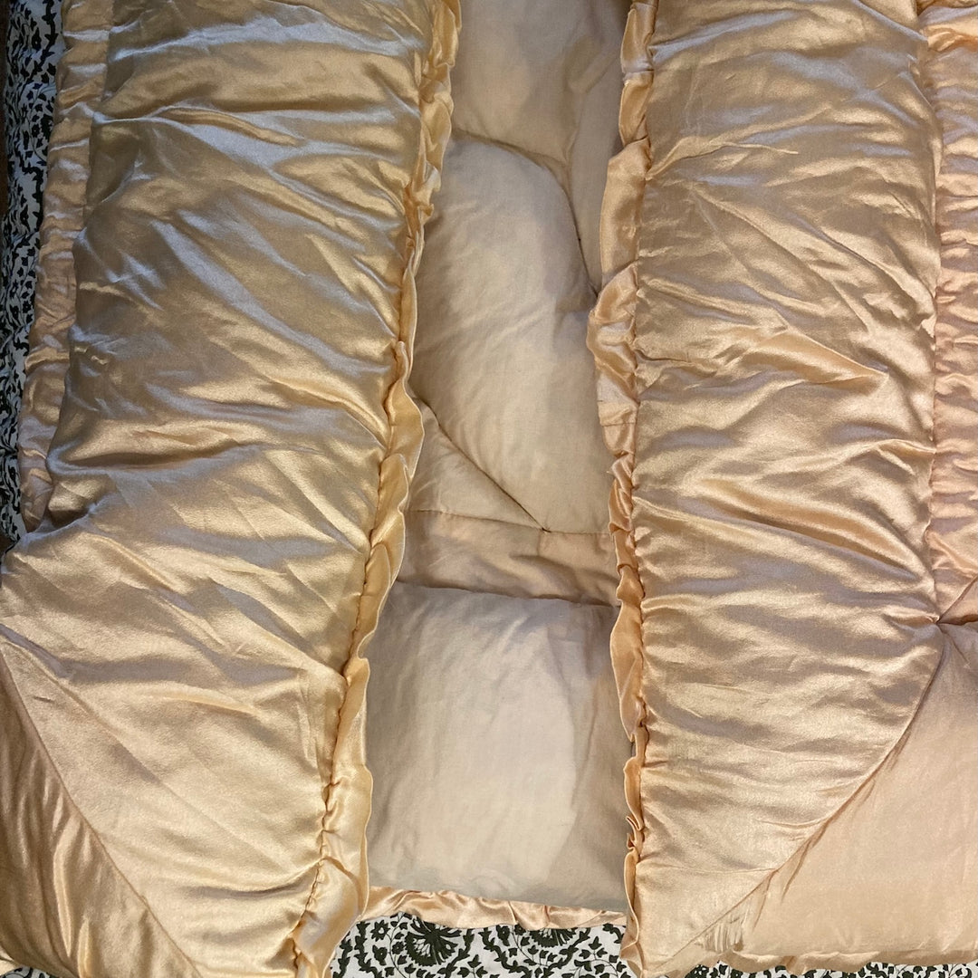 Vintage 1930s Single Eiderdown with creamy apricot gold satin top and plush filling.