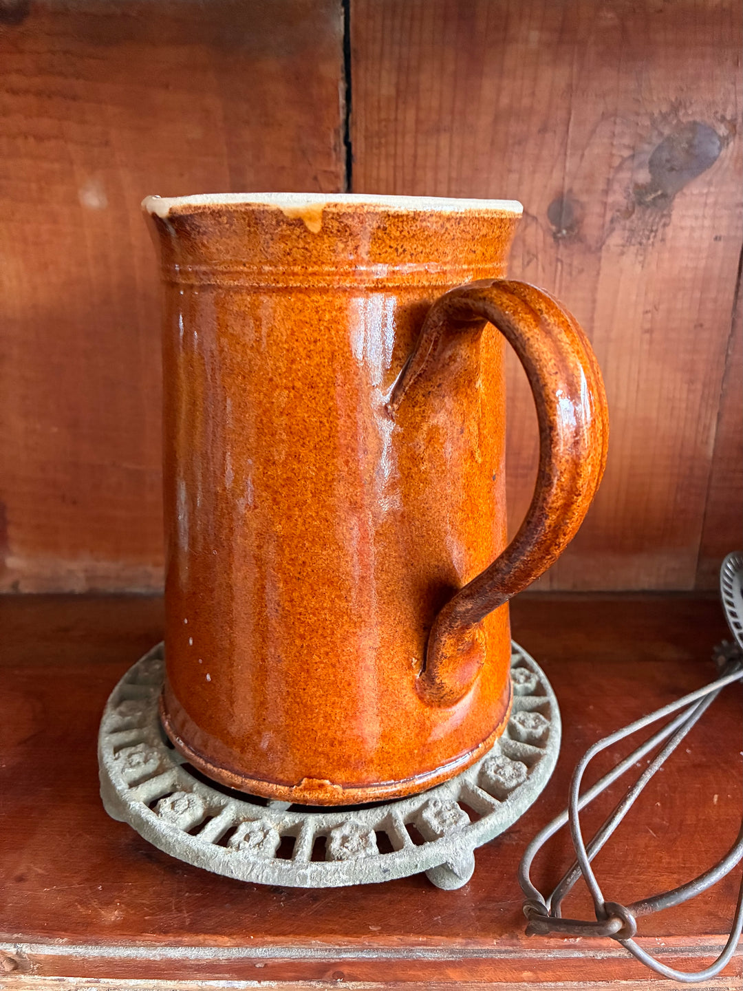 Antique French Earthenware Milk Pitcher with textured orange glaze, perfect for serving hot milk or as a farmhouse vase.