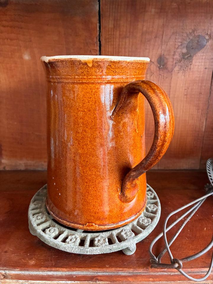 Antique French Earthenware Milk Pitcher with textured orange glaze, perfect for serving hot milk or as a farmhouse vase.