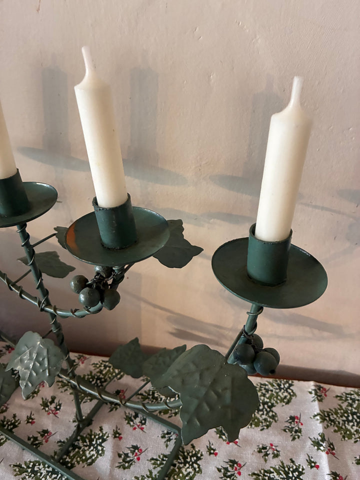 Vintage Green Five Arm Candelabra with vine leaves and candles, perfect as a table centerpiece from Source for the Goose Devon.