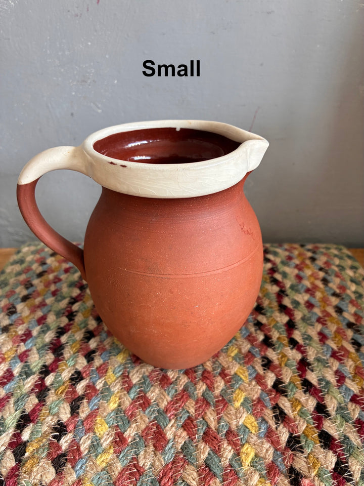 Vintage Slipware Terracotta Jug - North Devon small jug on woven textile background