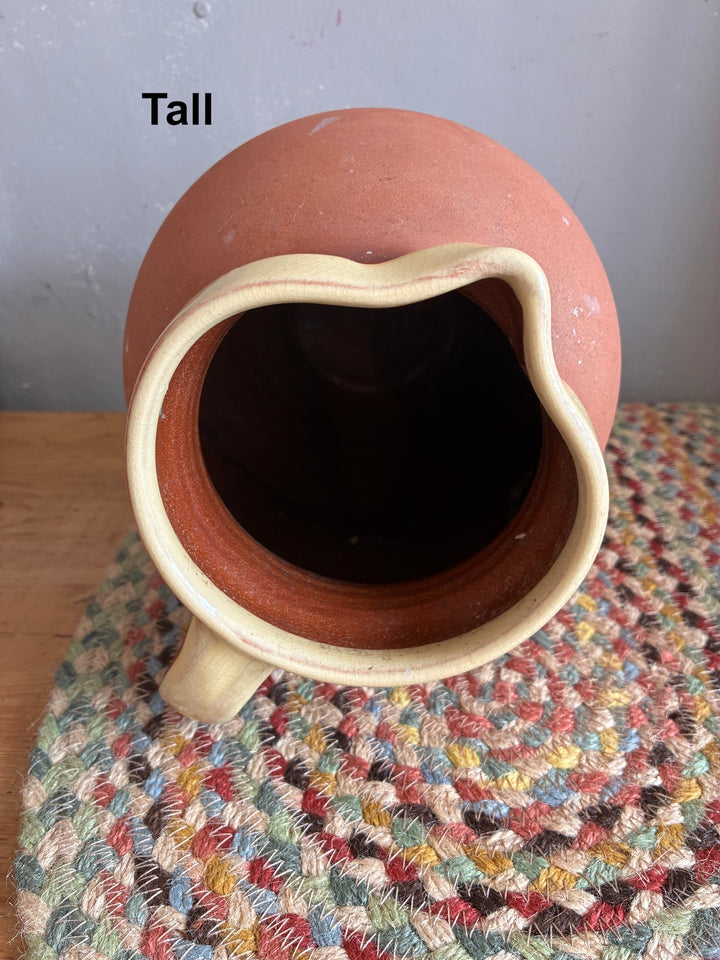 Vintage Slipware Terracotta Jug - North Devon viewed from above, showcasing tall design and cream slipware rim.