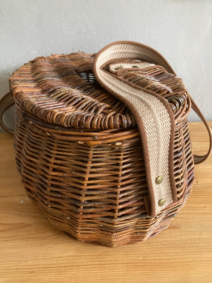 Wicker fishing creel with carrying strap, perfect for outdoor use or rustic home storage. Source for the Goose Devon.