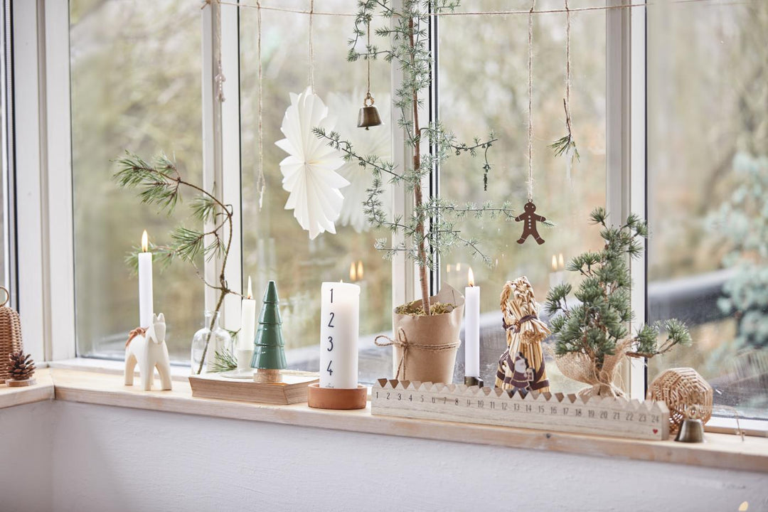 vintage styled Christmas decor on windowsill 