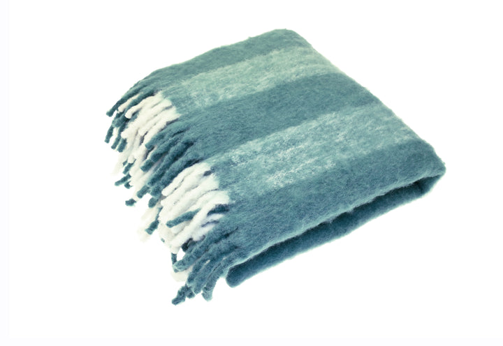 Wool Blend Glacier Blue Wide Stripe Throw folded with tassels, perfect for cozy home decor by Source for the Goose.