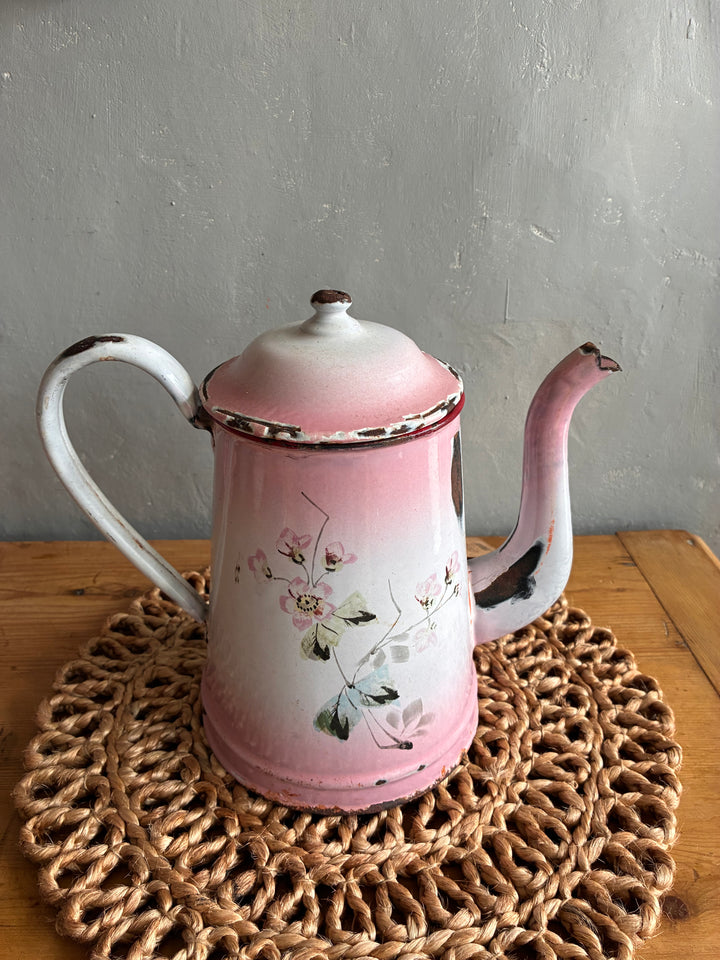 Vintage pink and white French enamel coffee pot with hand-painted bird design and distressed finish.