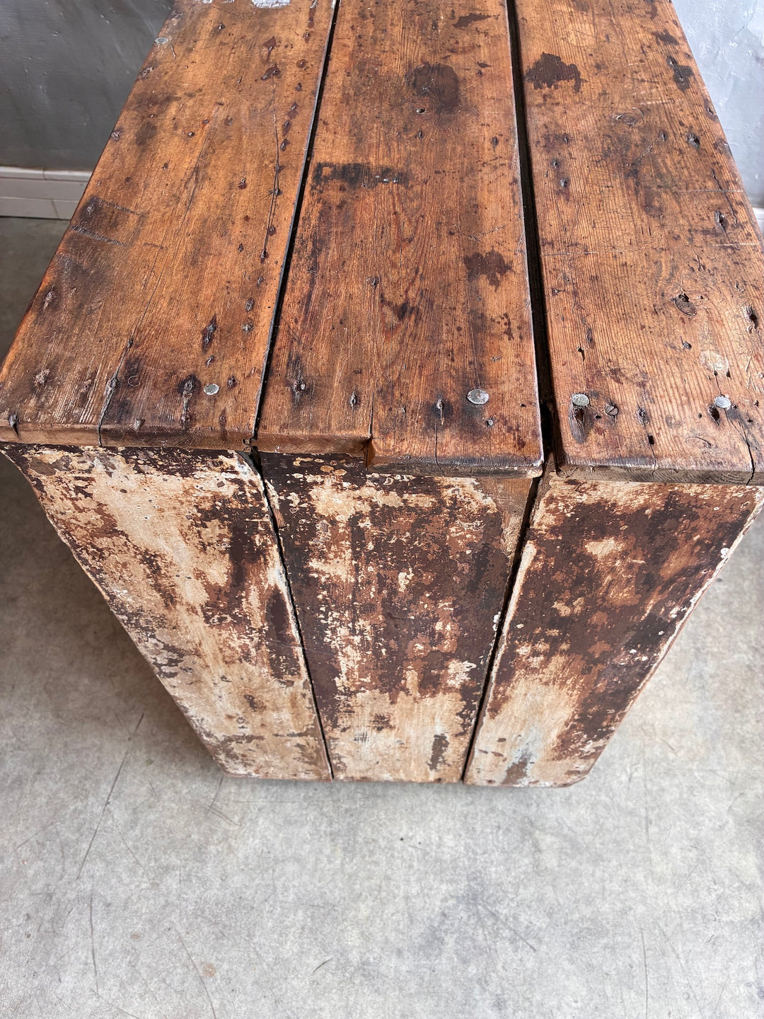 Primitive Antique Pine Wooden Sideboard featuring a weathered, rustic wooden top with historical charm and character.