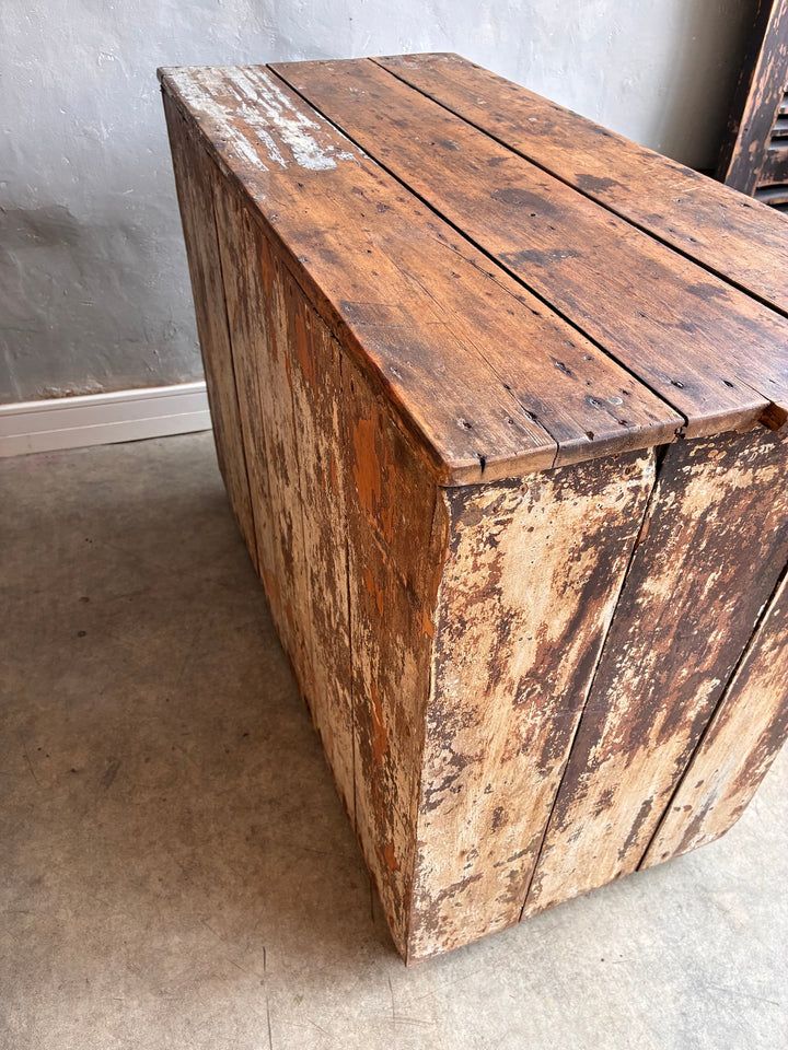 Side view of a rustic Primitive Antique Pine Wooden Sideboard with a distressed finish and weathered textures.