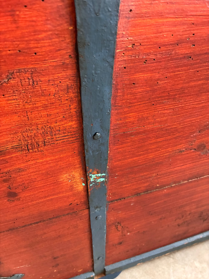 Close-up of Antique Danish Dowry Chest showing blue iron hinges and painted wooden surface details.