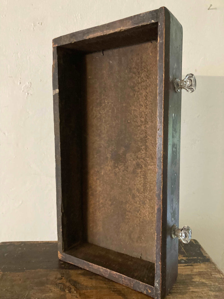 retro glass handles on drawer of mini chest