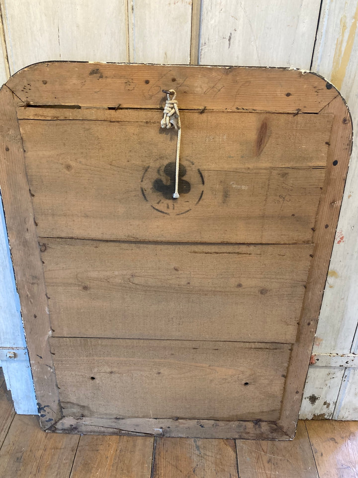Back of a Vintage Arch Top French Mirror with wood texture and hanging hook, adding antique charm to any decor.