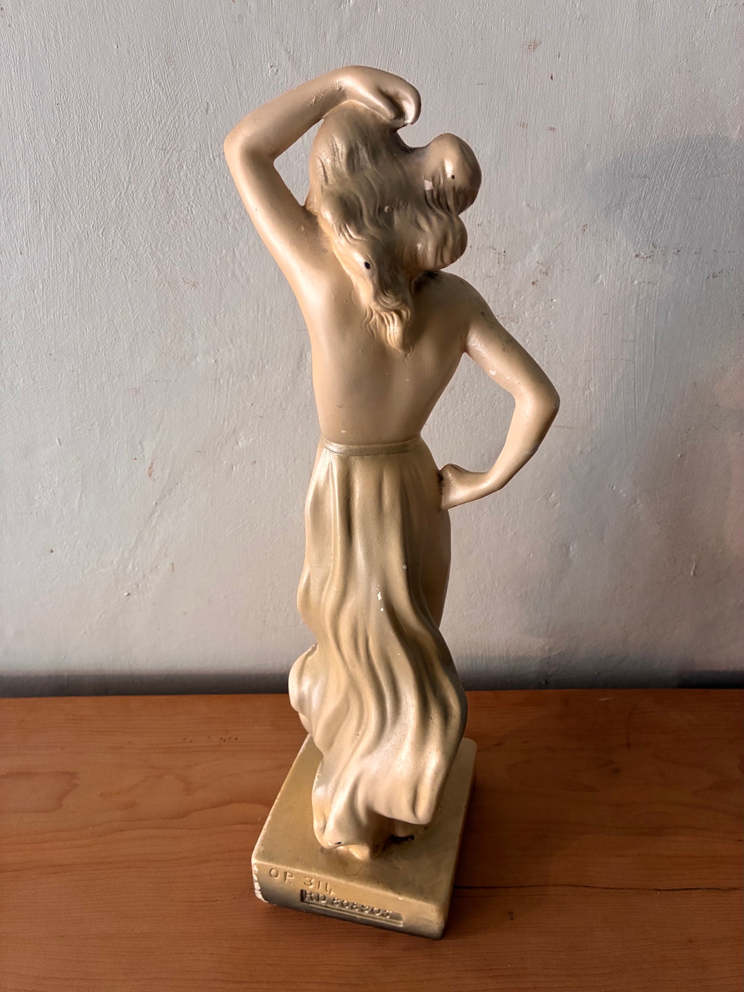 Antique Art Deco Chalkware Lady Figurine showcasing a vintage home design with elegant fluid lines and stylish silhouette.