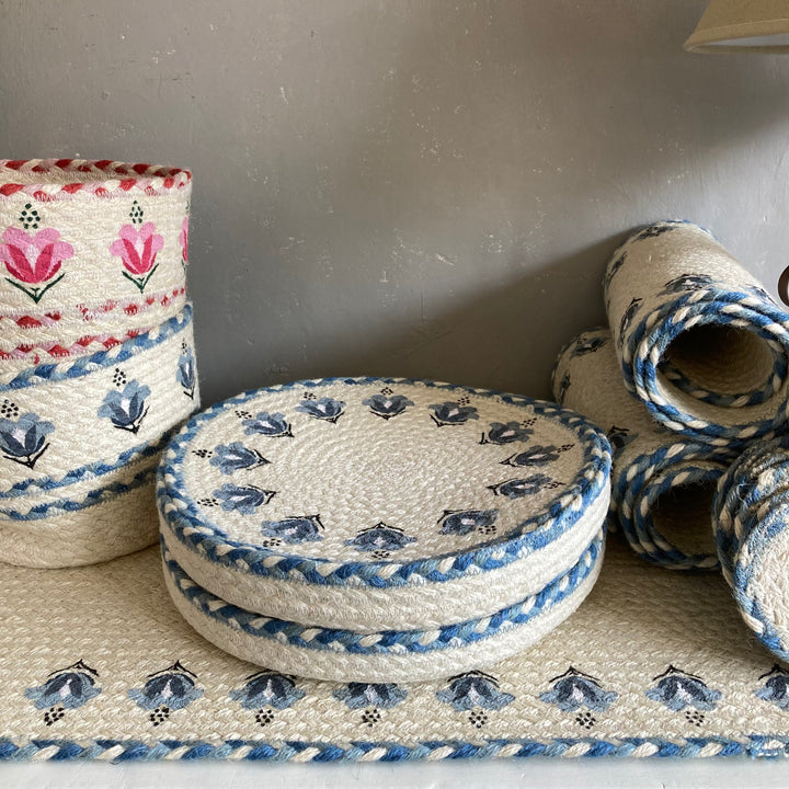 Pink and blue lily jute products by the Braided rug Company