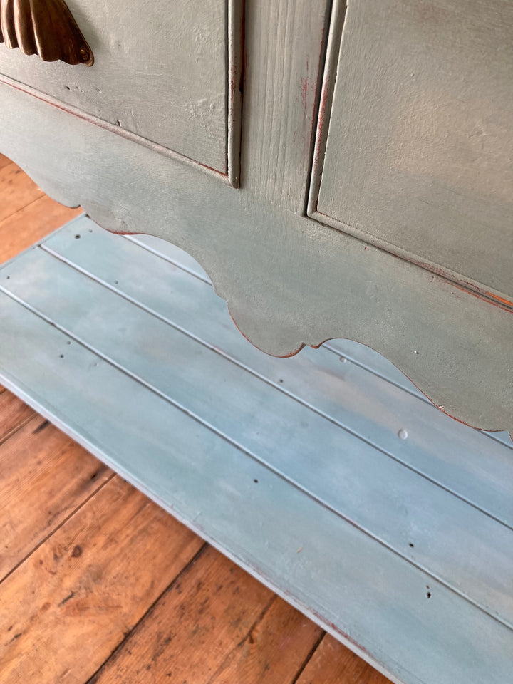 Close-up of vintage blue painted dresser highlighting intricate detailing and worn paint finish from Source for the Goose, Devon.