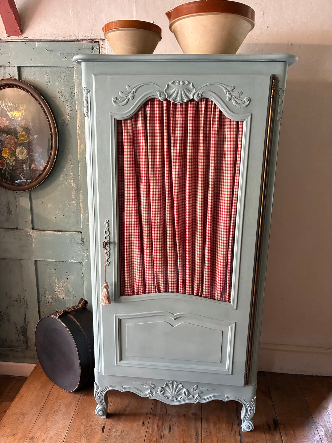 Small Blue Painted French Armoire with half-glazed door and red gingham curtain from Source for the Goose Devon.