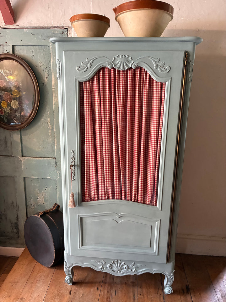 Small Blue Painted French Armoire with half-glazed door and red gingham curtain from Source for the Goose Devon.