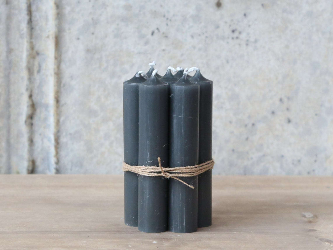 Bundle of 10 coal black stubby dinner candles at Source for the Goose, Devon