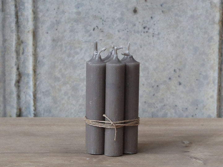 bundle of stubby dinner candles in flax at Source for the Goose 