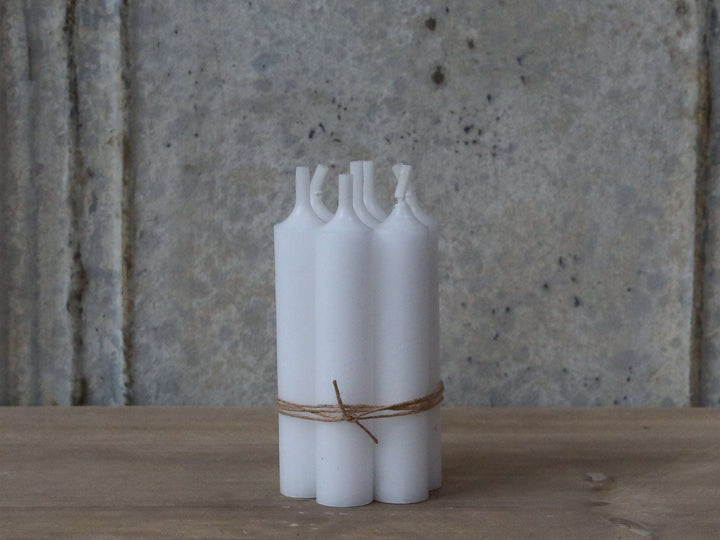 Bundle of 10 white stubby dinner candles at Source for the Goose Interiors