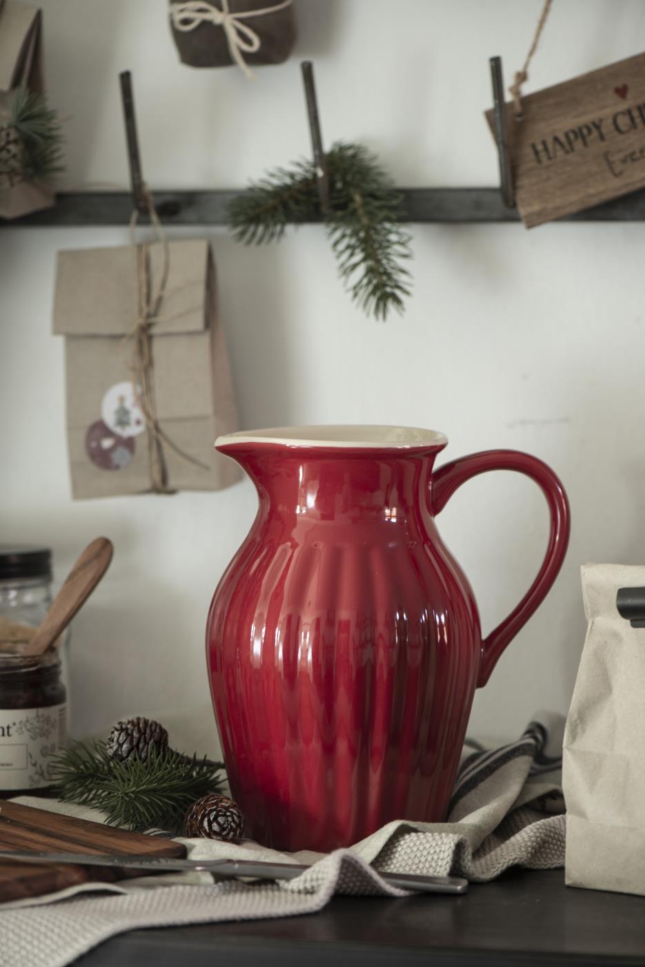 ribbed red jug with white interior