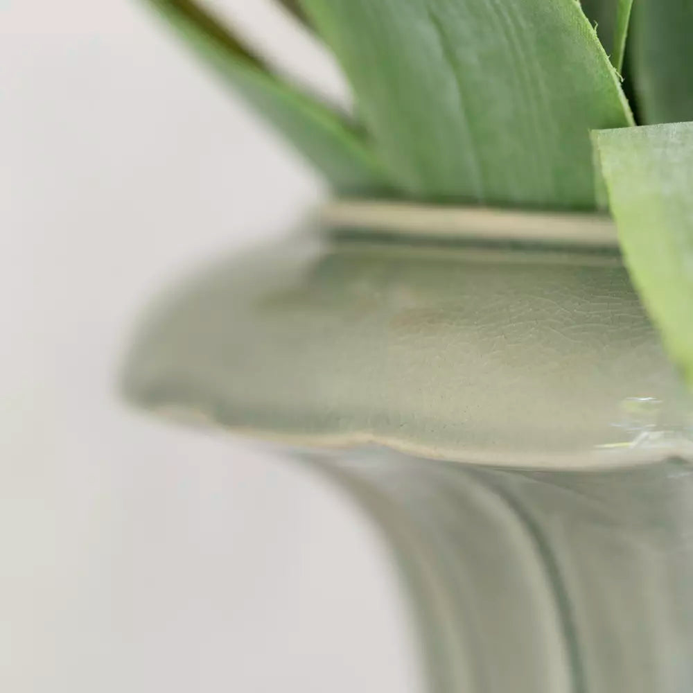 Close-up of Pretty Green Ceramic Planter Vase featuring soft green glaze and elegant sculpted design.