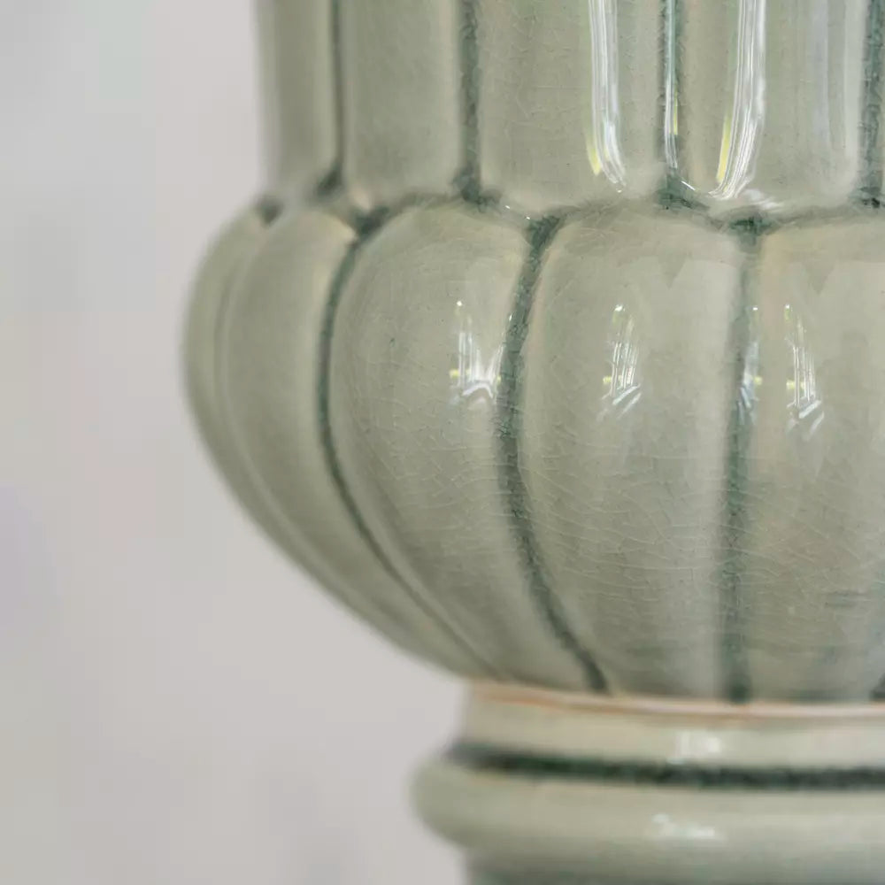 Close-up of Pretty Green Ceramic Planter Vase with timeless design and soft green glaze, ideal for plants.