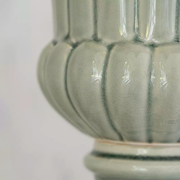 Close-up of Pretty Green Ceramic Planter Vase with timeless design and soft green glaze, ideal for plants.