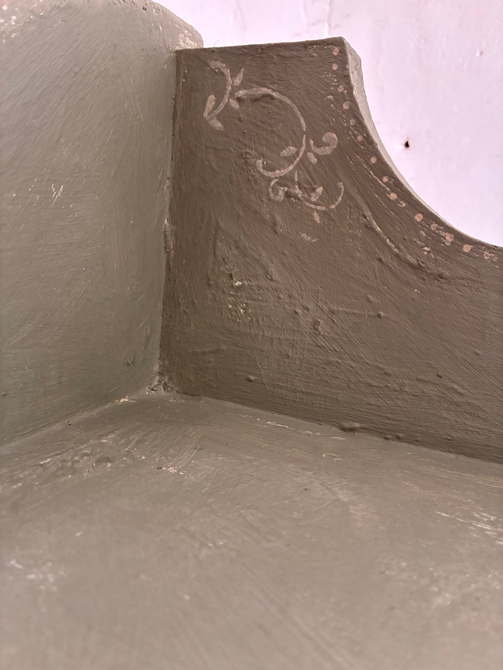 Close-up of the textured surface and scallop detailing of the Tall Chippy Green Bookcase by Source for the Goose Devon.