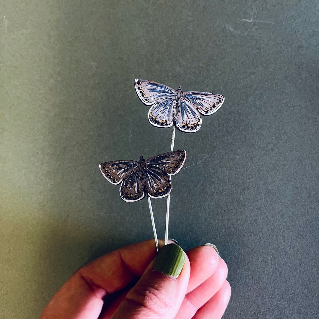 Handcrafted butterfly pot sitters by Lily Faith, adding charm to indoor plants with playful designs from Devon.