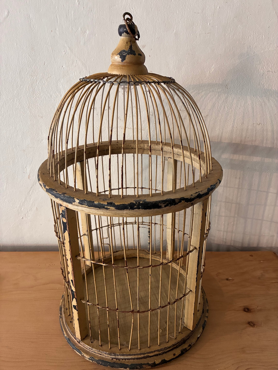 Decorative Antique Wooden Bird Cage with a dome top, showcasing vintage style and distressed cream finish for vintage home decor.