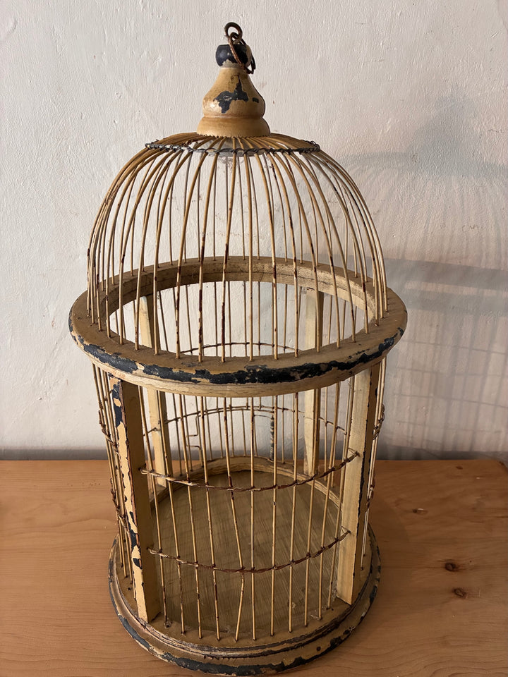 Decorative Antique Wooden Bird Cage with a dome top, showcasing vintage style and distressed cream finish for vintage home decor.