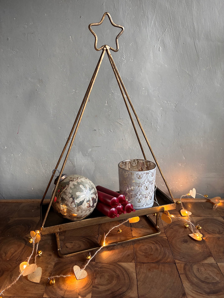Star Topped Gold Metal Christmas Tree Tray displaying candles and ornaments for festive decor by Source for the Goose Devon.
