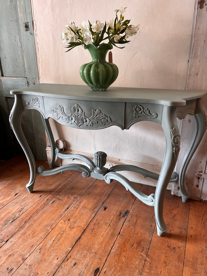 Duck Egg Blue Console Table with Cabriole Legs showcasing floral carvings and a decorative vase of flowers.