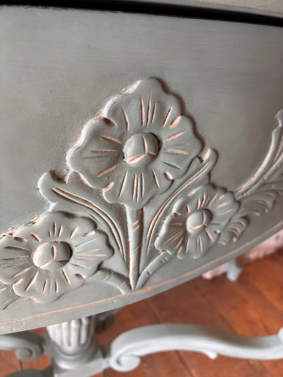 Close-up of floral carvings on the Duck Egg Blue Console Table with Cabriole Legs showcasing elegant details.