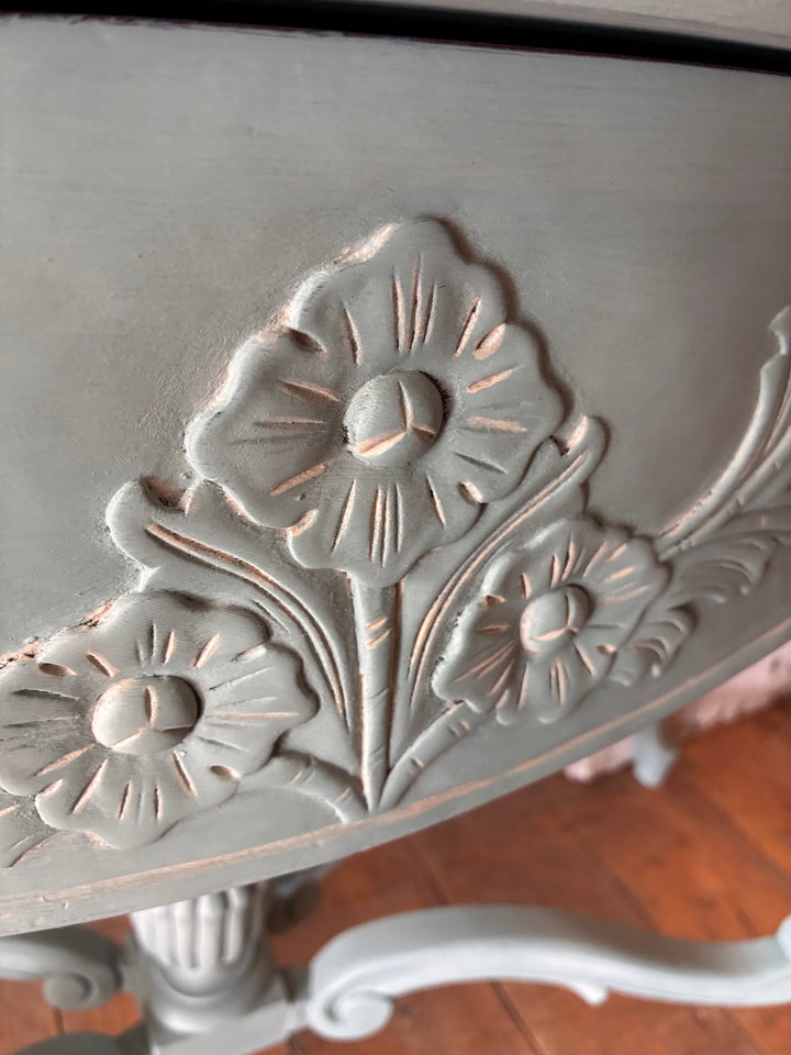 Close-up of floral carvings on the Duck Egg Blue Console Table with Cabriole Legs showcasing elegant details.