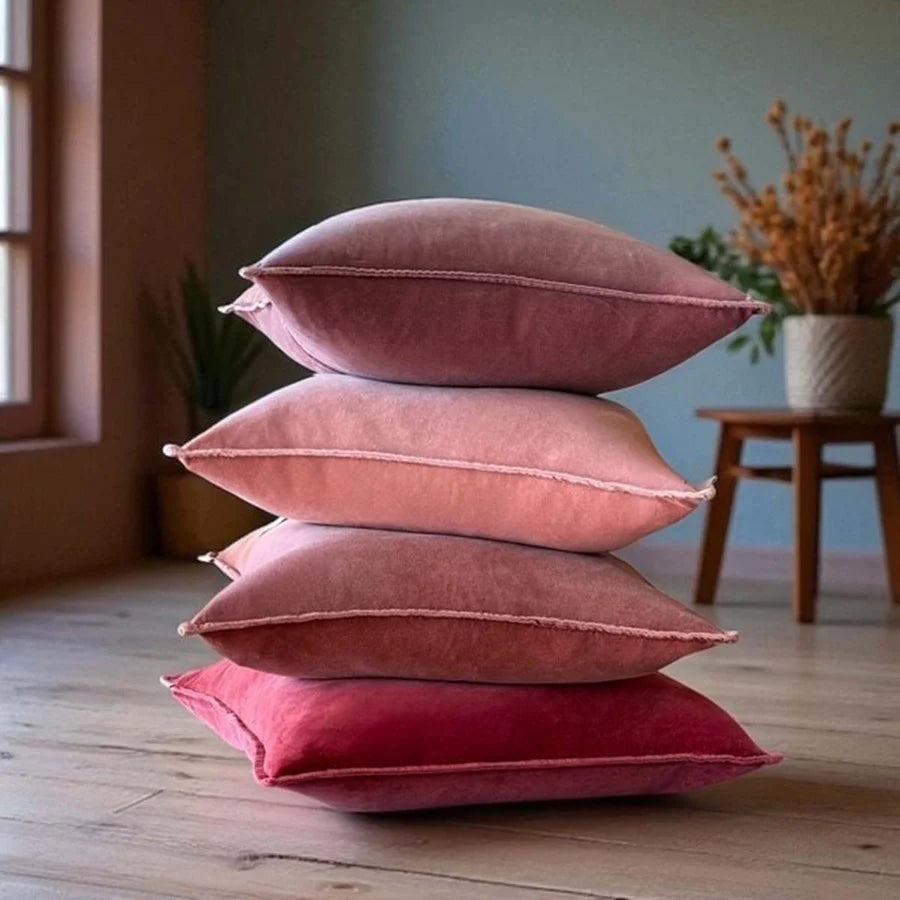 Stonewashed velvet cushions in dusky pink and caramel shades, adding cozy luxury to any home – Source for the Goose, Devon.