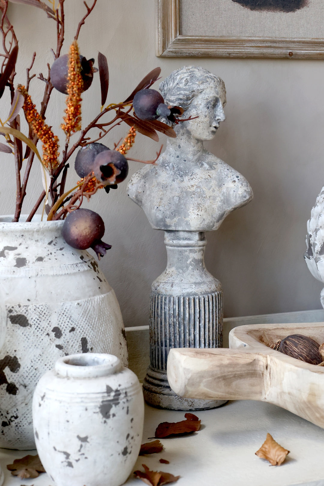 Classical Female Decorative Bust surrounded by vases and autumnal decor, perfect for elegant home styling.