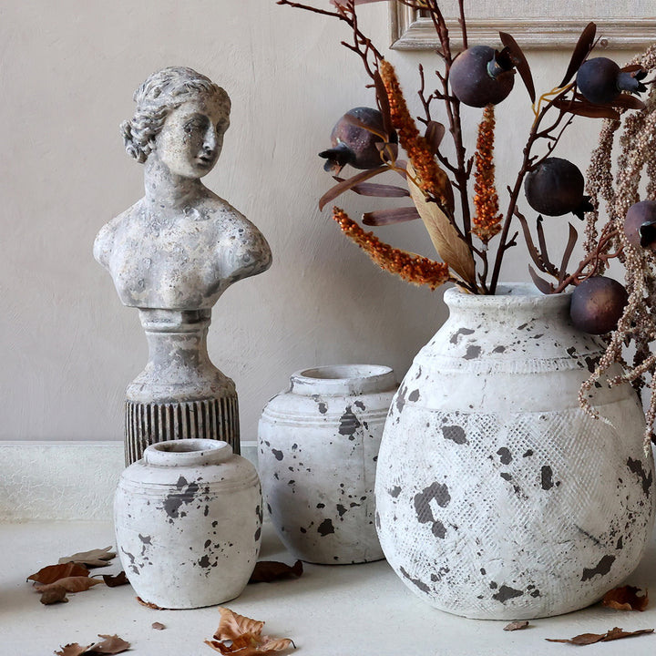 Classical Female Decorative Bust by Source for the Goose, surrounded by vintage-style vases and dried flowers.