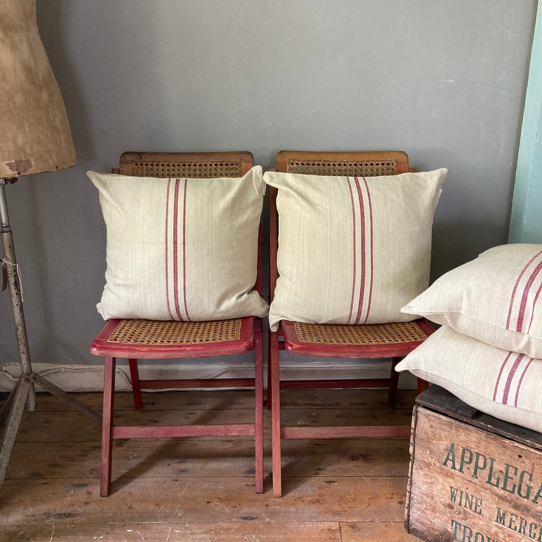 old folding chairs with red striped ticking cushions