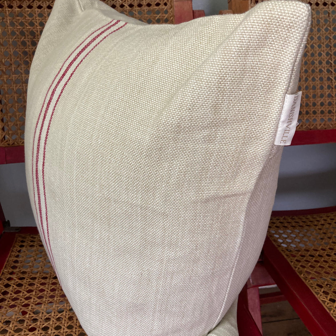 linen colour cushion with red stripes in middle