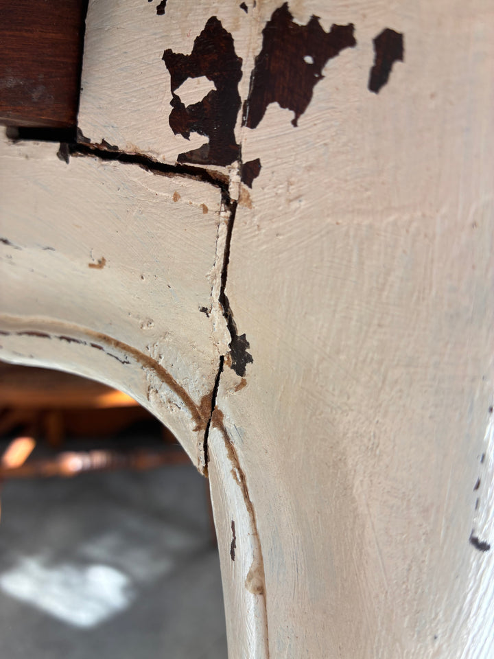 Close-up of the Vintage French Oak Parquet Top Table - Extending showing detailed crack and paint imperfections.