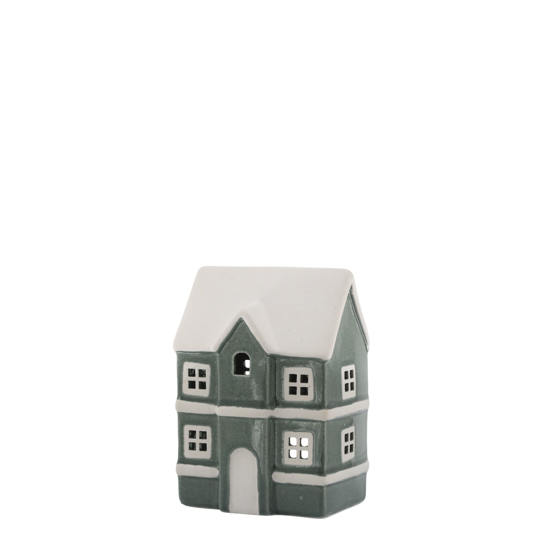Green ceramic house tealight holder with snowy roof, perfect for cozy winter ambiance from Source for the Goose, Devon.